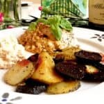 Feta stuffed chicken with roasted beets and potatoes on a plate