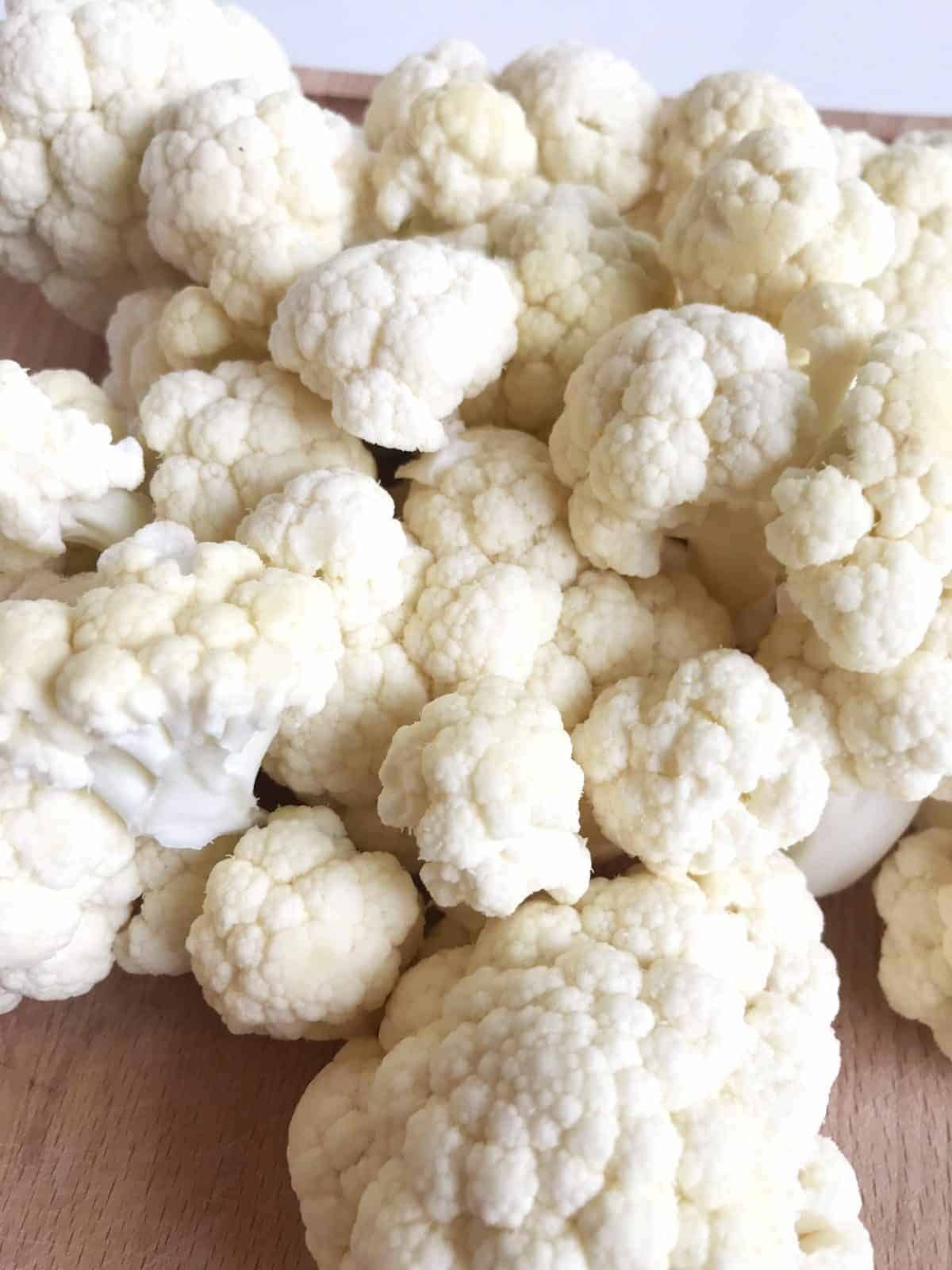 Cauliflower florets on wooden tray