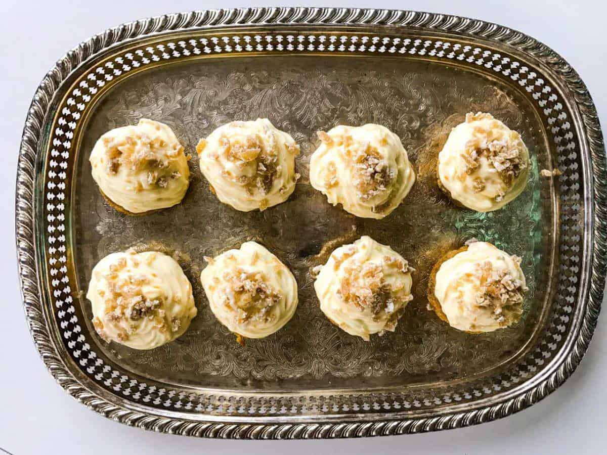 Orange ginger carrot cupcakes on a silver tray