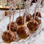 honey balsamic glazed gingerbread spice meatballs with toothpicks on a glass platter