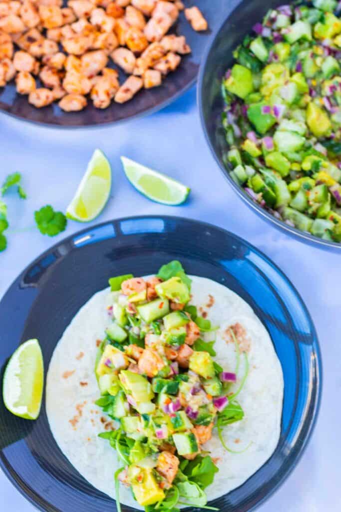 top vew of healthy salmon taco with ginger avocado salsa