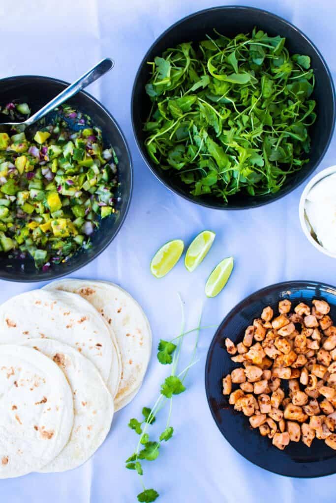 top view of ingredients for healthy salmon fish taco with ginger avocado salsa