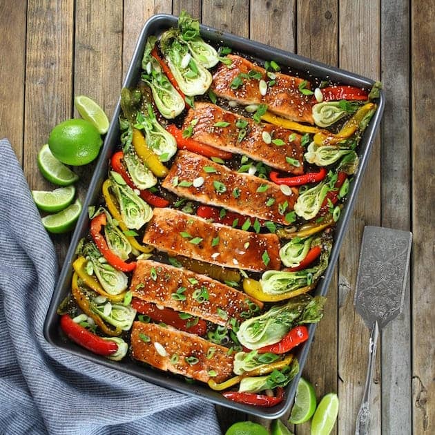 top down view of salmon with veggies on a sheet pan