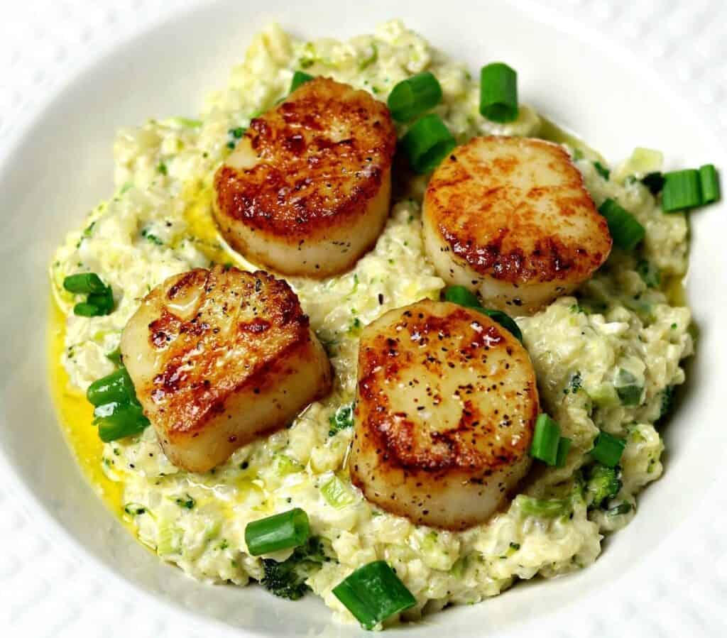 seared scallops on top of with cauliflower risotto