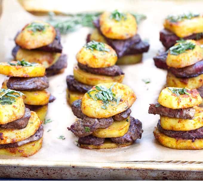 steak ant potato stacks topped with parsley