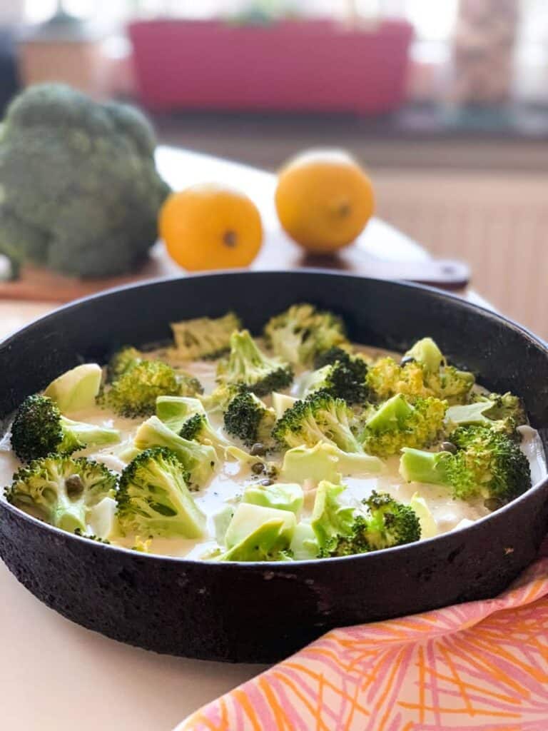 one-pan fish & broccoli in lemon butter caper sauce in a cast iron skillet