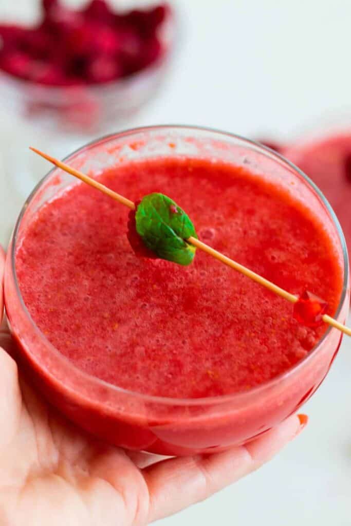 close up of a glass of raspberry grapefruit mocktail