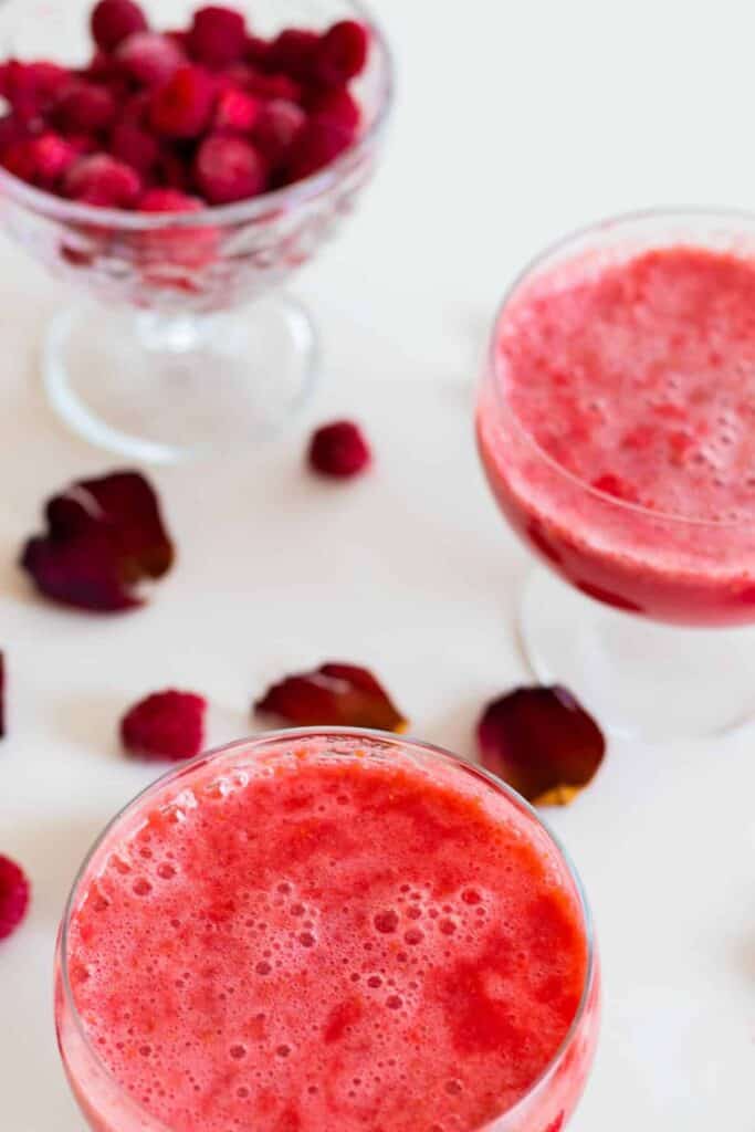 two glasses of sparkling raspberry grapefruit mocktail without decorations