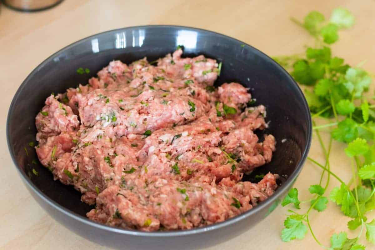 ingredients for lamb meatbals mixed together