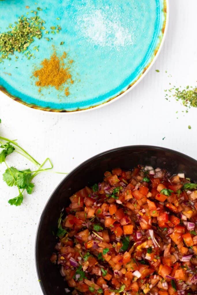 top view of pico de gallo alsa in a black bowl