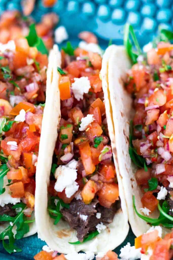 closeup of vegetarian tacos with black beans