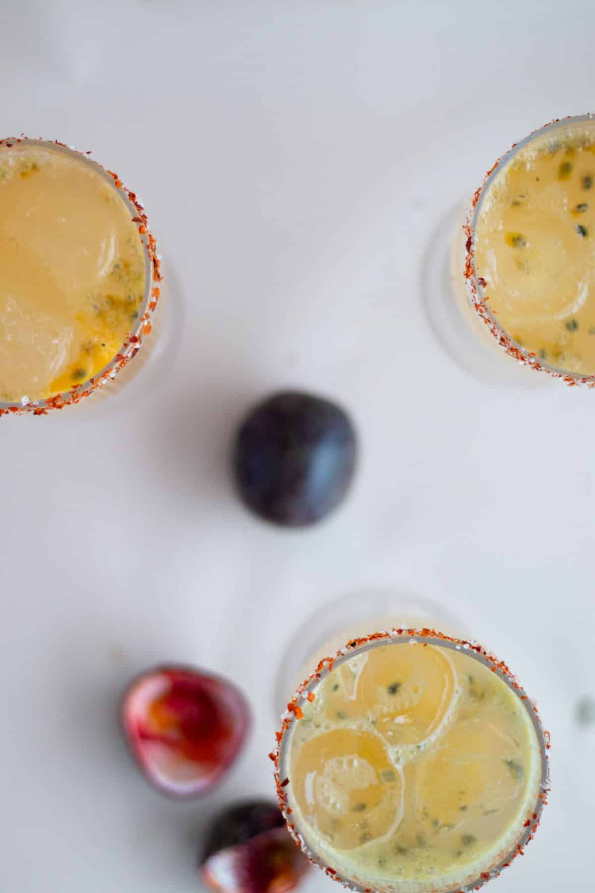 top view of three kombucha passion fruit spritz