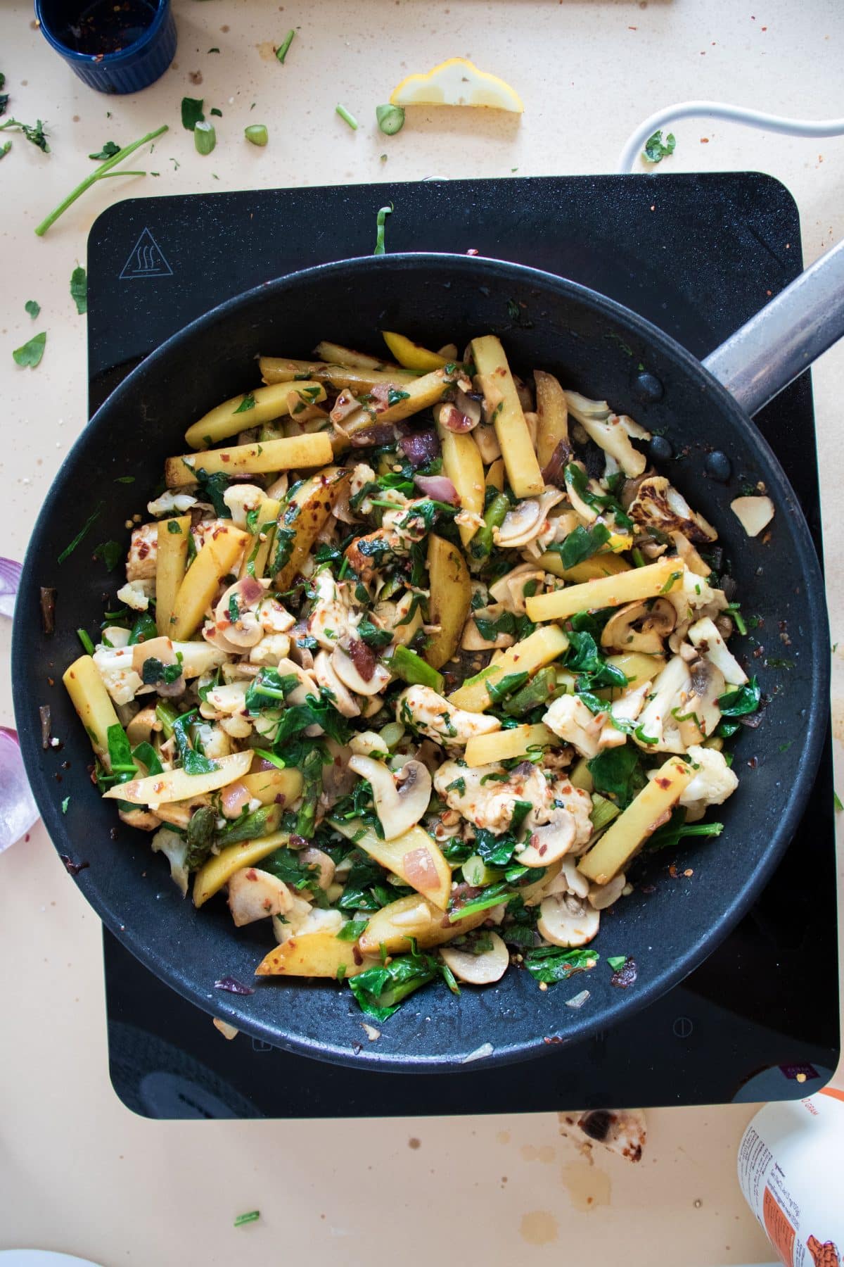 top view of potato halloumi stir-fry in a pan