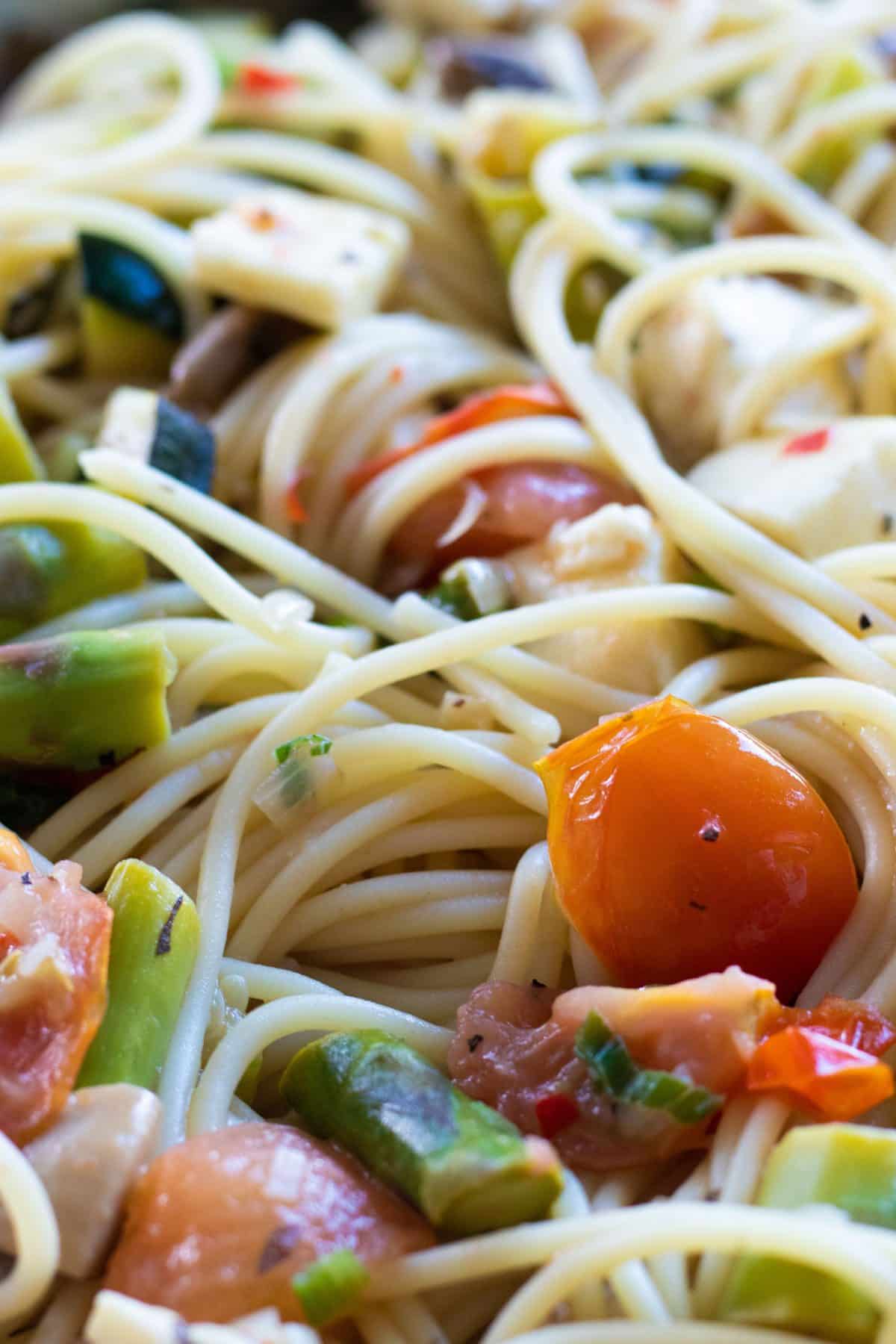 closeup of pasta with halloumi and vegetables
