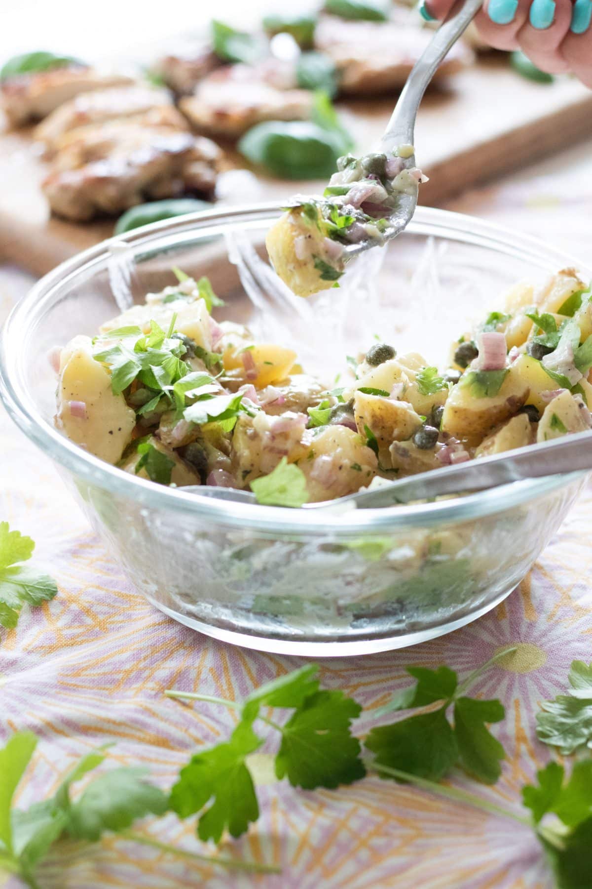 taking a bite of french potato salad