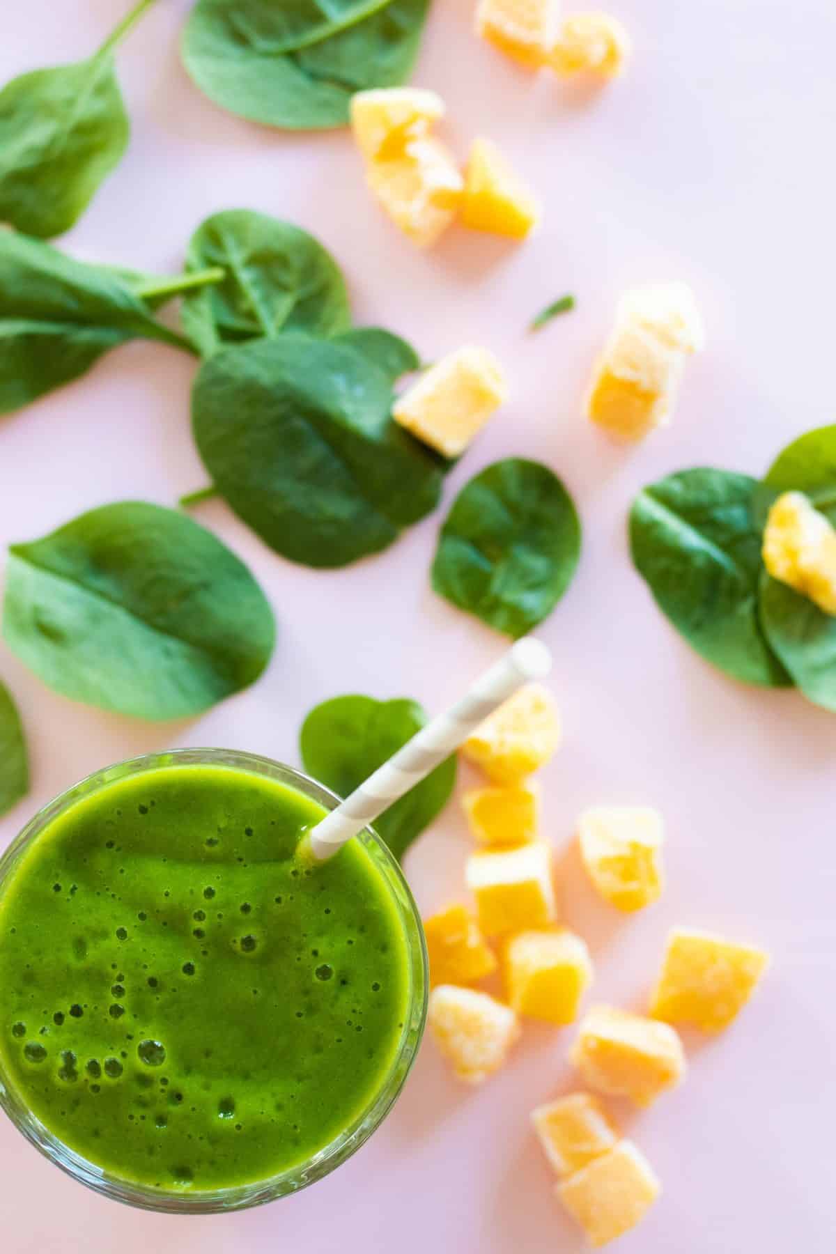 top down view of a mango spinach smoothie.