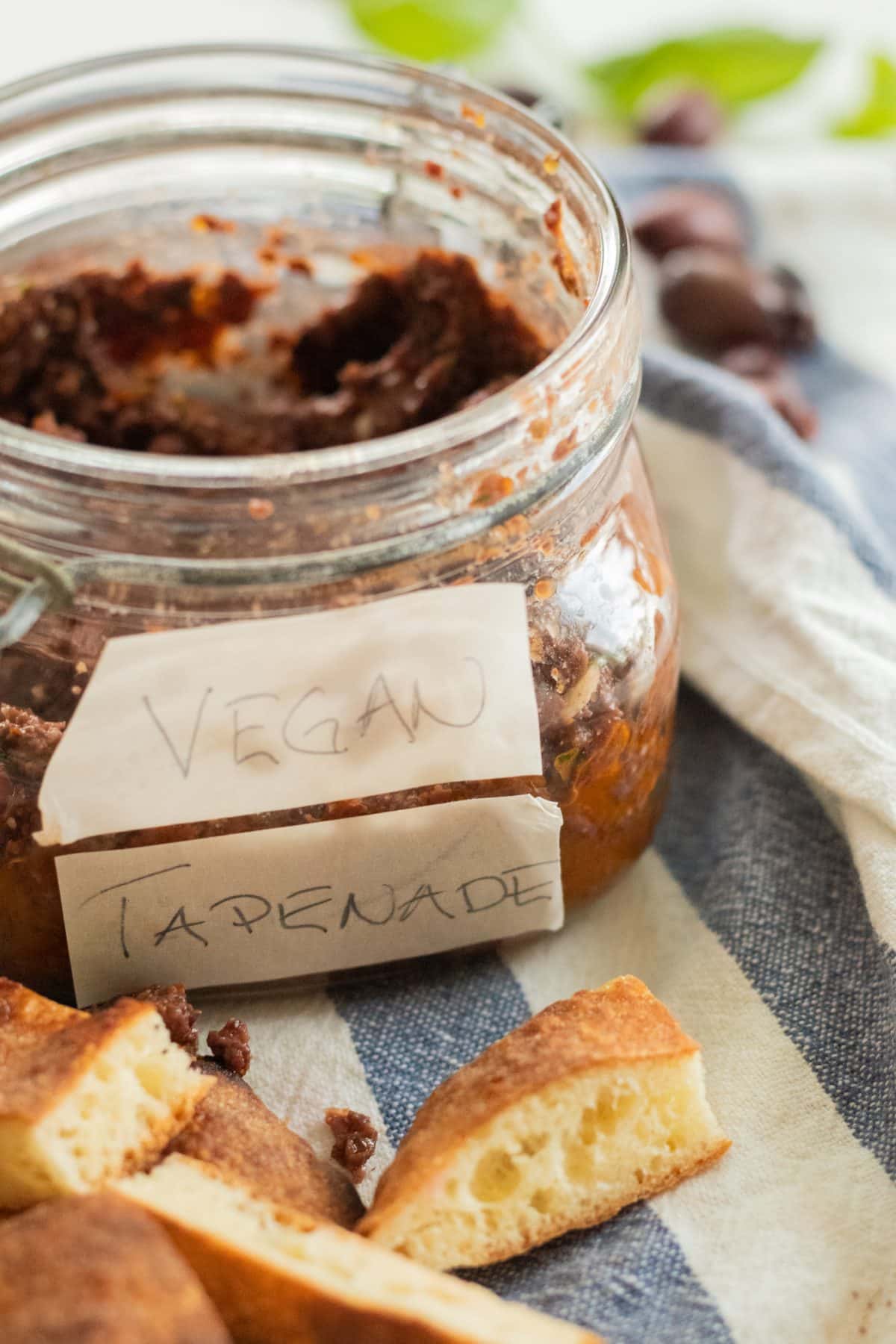 sideview of a jar with tapenade with tapenade with vegan tapenade written on the jar