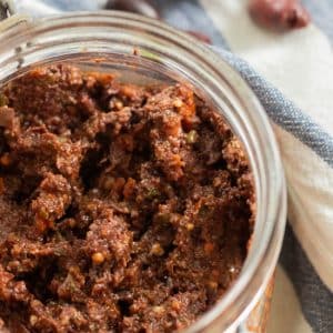 top down closeup of tapenade in a jar