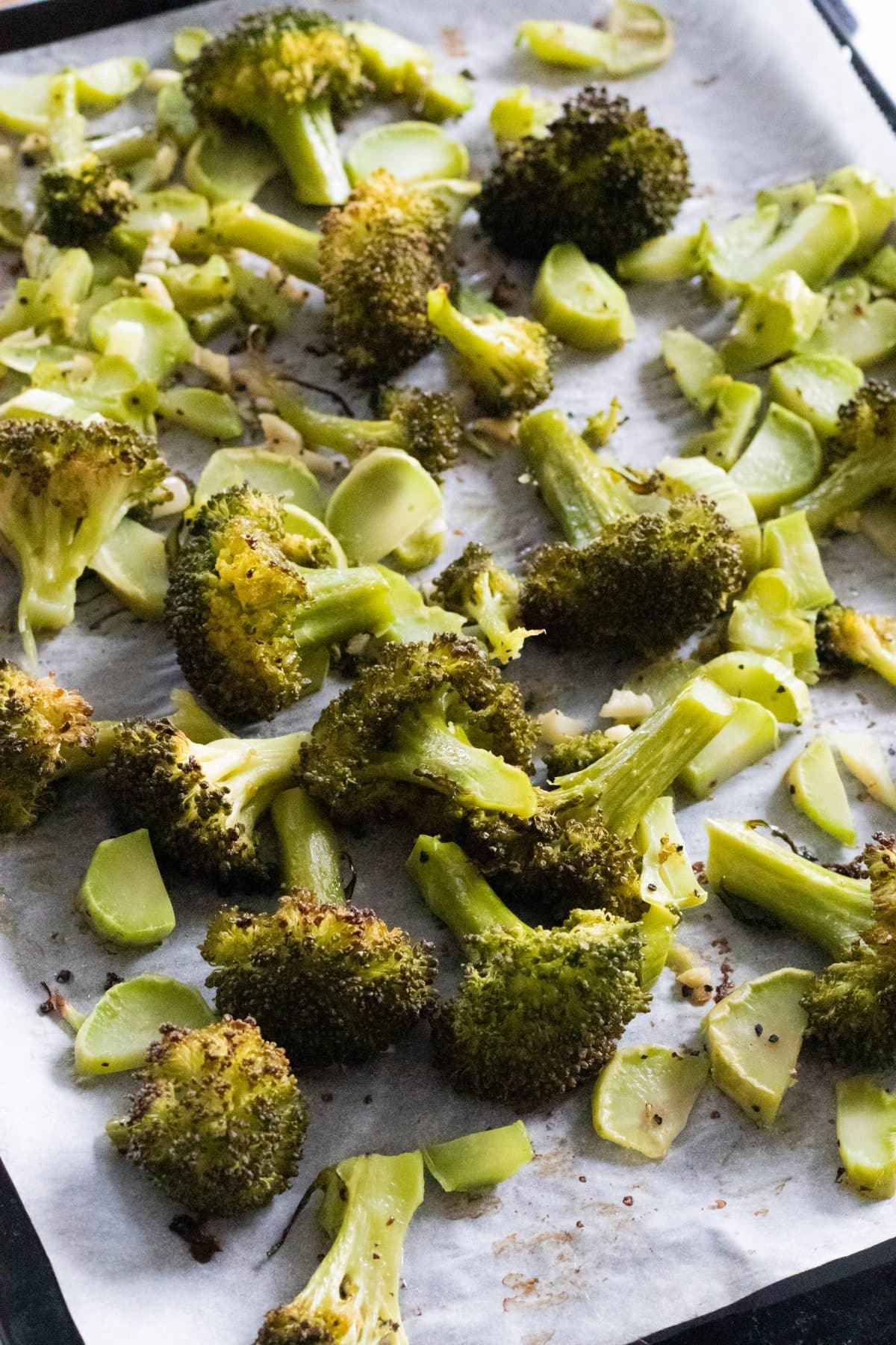 top view of an oven tray with garlic roasted broccoli