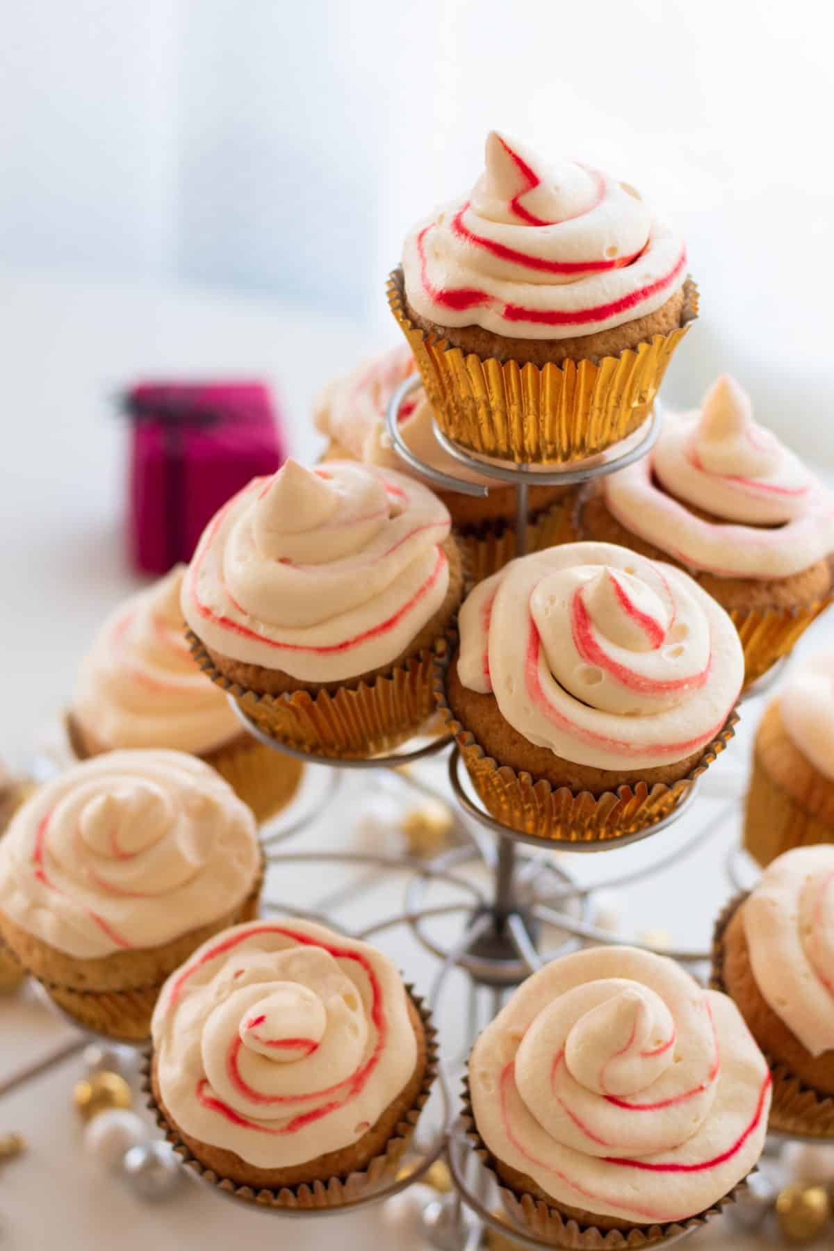 side view of candy cane cupcakes on a cupcake stand
