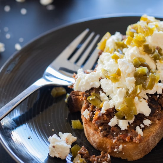 sidewview of tapenade sandwich and a fork