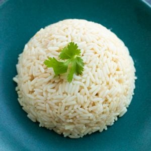 top down view of a mound of rice topped with parsley