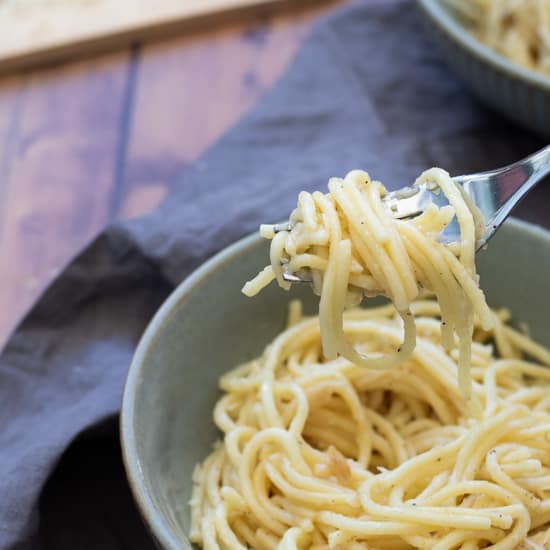 A forkful of garlic butter pasta.