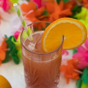 sex on the beach mocktail decorated with an orange slice and a straw
