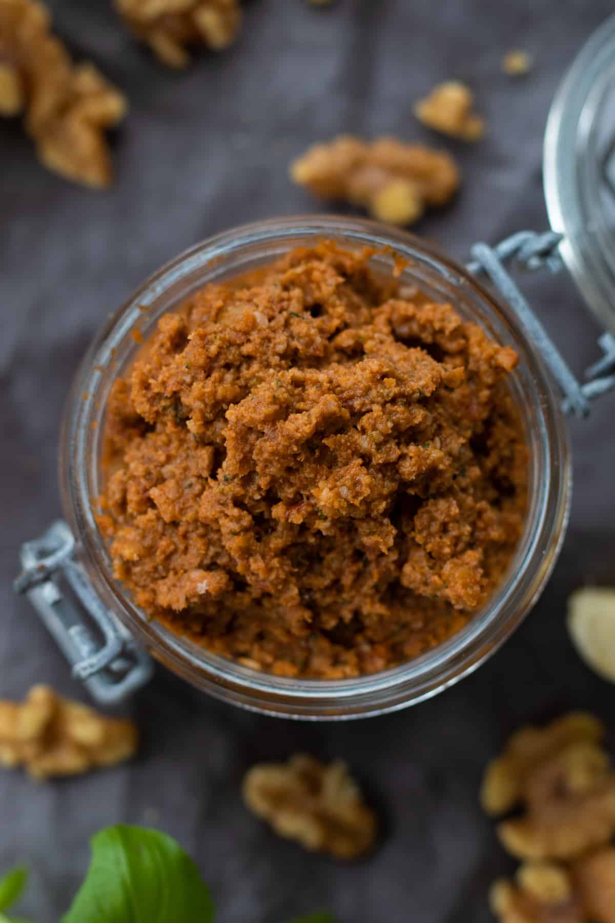 top down view of red pesto in a jar