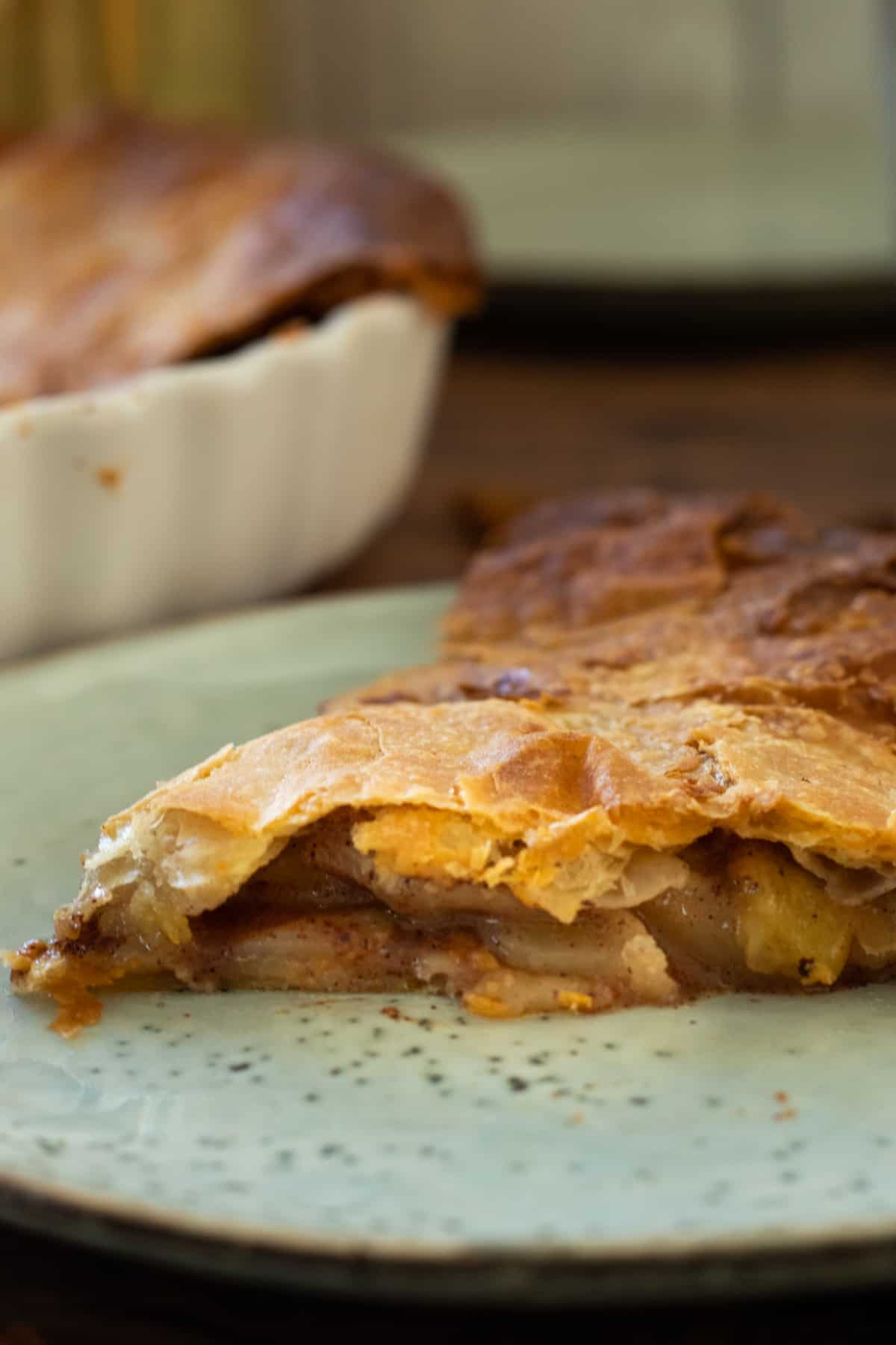 a slice of puff pastry apple pie