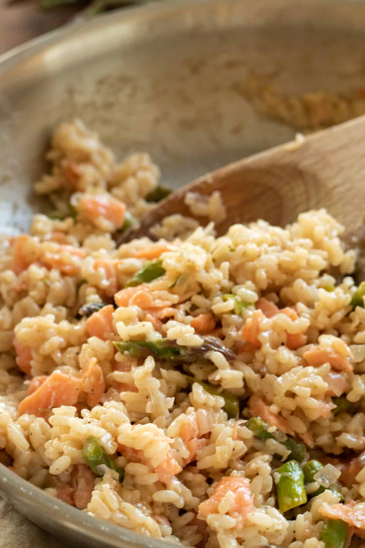 close-up of smoked salmon risotto in a pan.