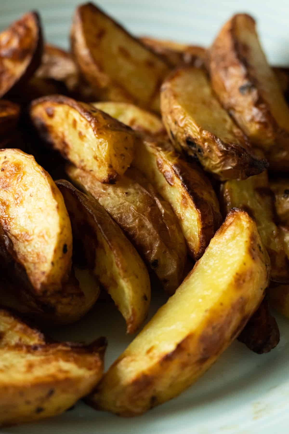 close up of air fryer potato wedges