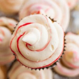 Peppermint whipped cream on top of a cupcake.