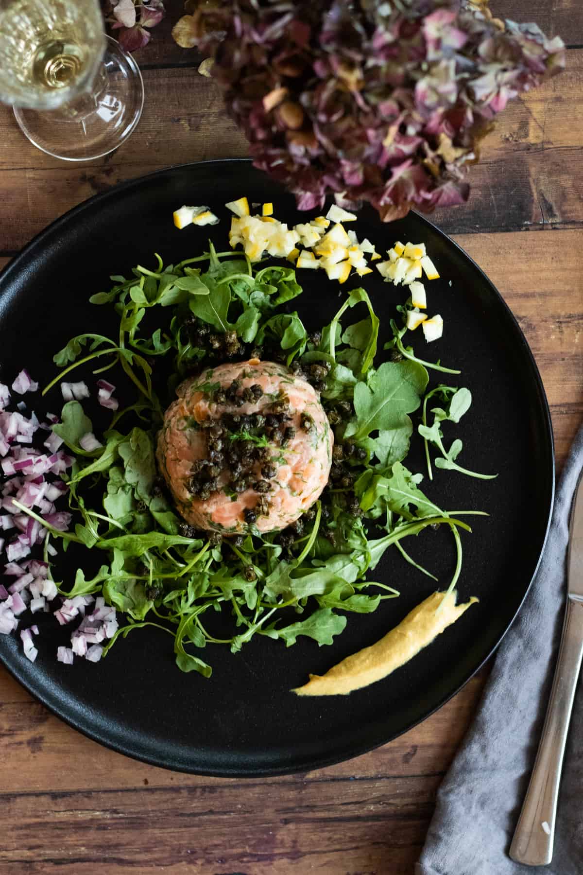 top down view of a deconastructed smoke salmon tartare