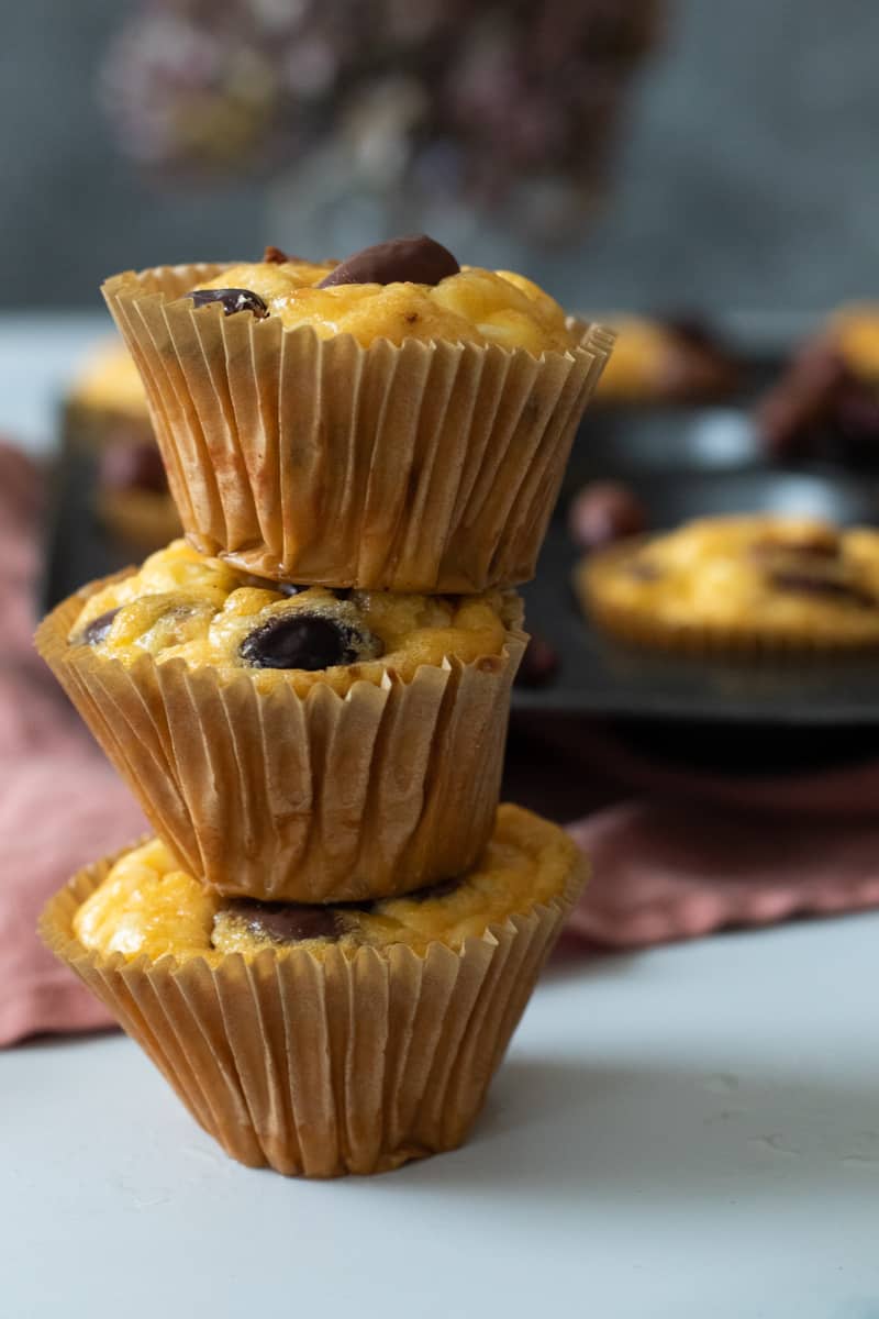 three breakfast muffins stacked on top of each other