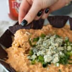 a chip loaded with buffalo chicken dip