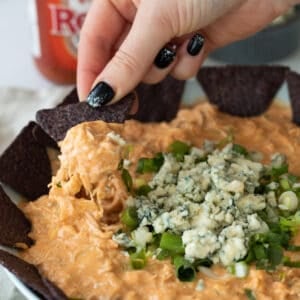 a chip loaded with buffalo chicken dip