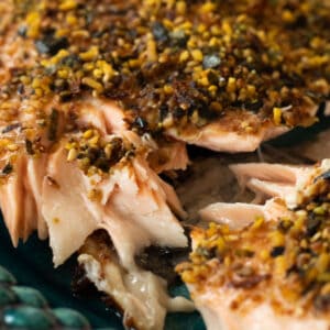 close up of furikake salmon on a blue green plate