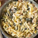 salmon spinach pasta in a pan.