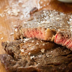sliced rib eye steak topped with salt