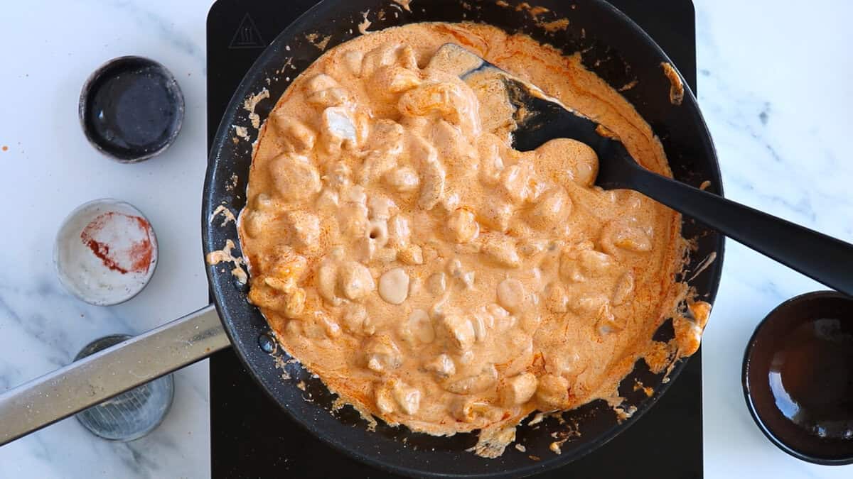 Making buffalo chicken sauce for buffalo chicken pasta bake.
