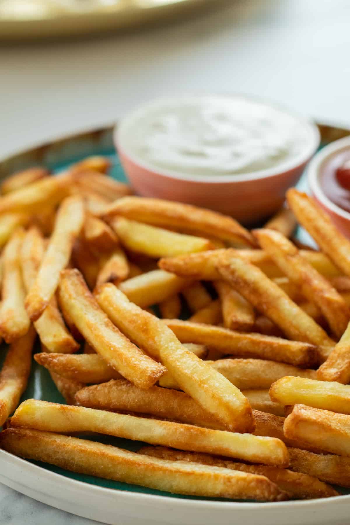 close up of french fries on a plate