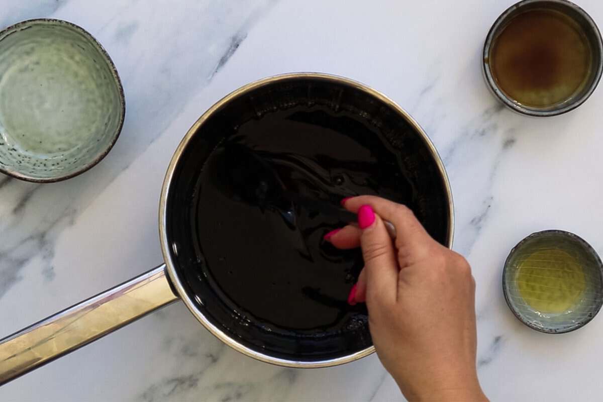 Mixing ingredients for 3 ingredient teriyaki sauce in a sauce pan.