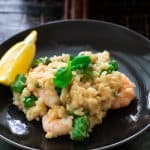 Shrimp and asparagus risotto on a plate.
