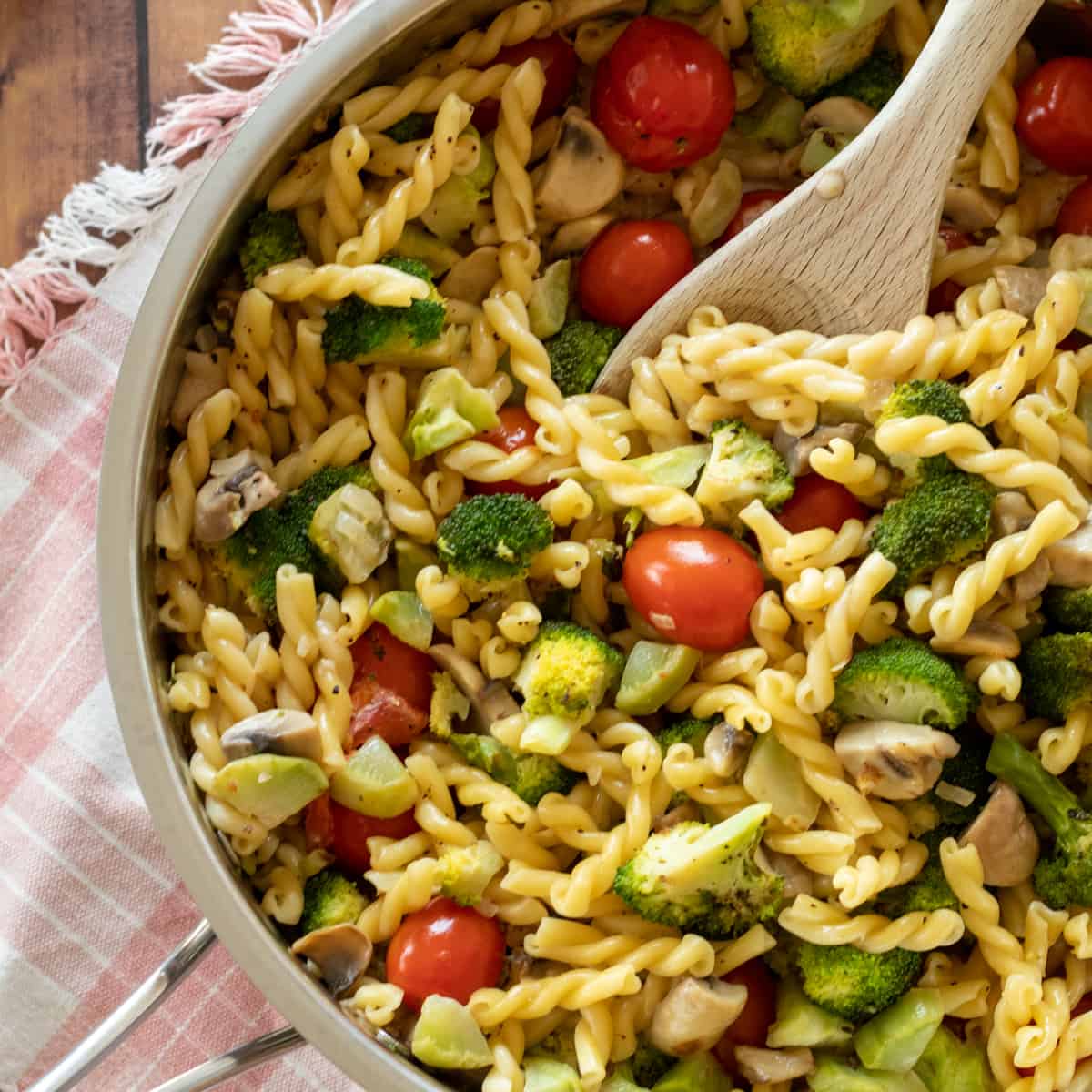 creamy broccoli pasta in a skillet.