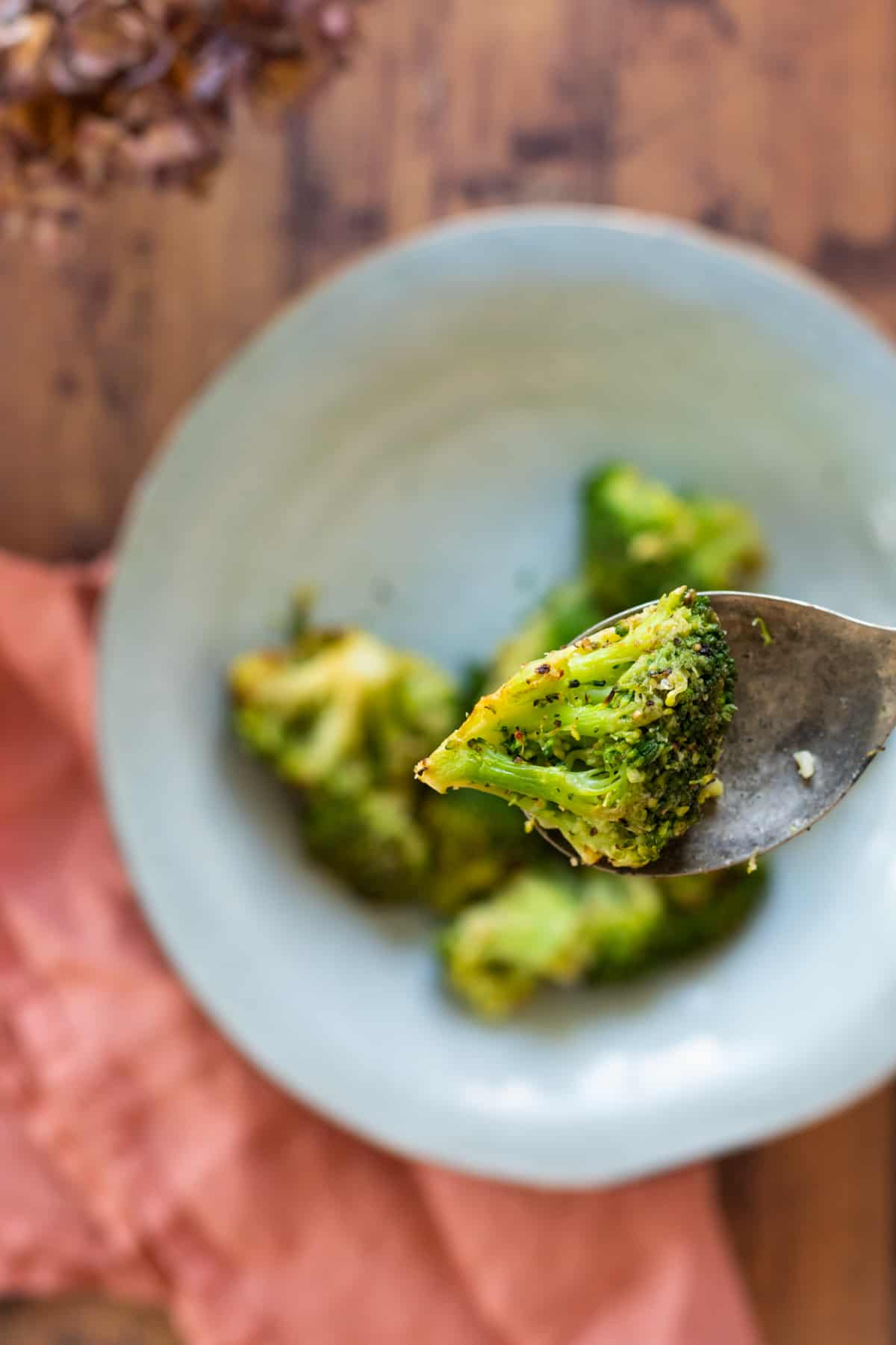 a piece of broccoli on a fork.