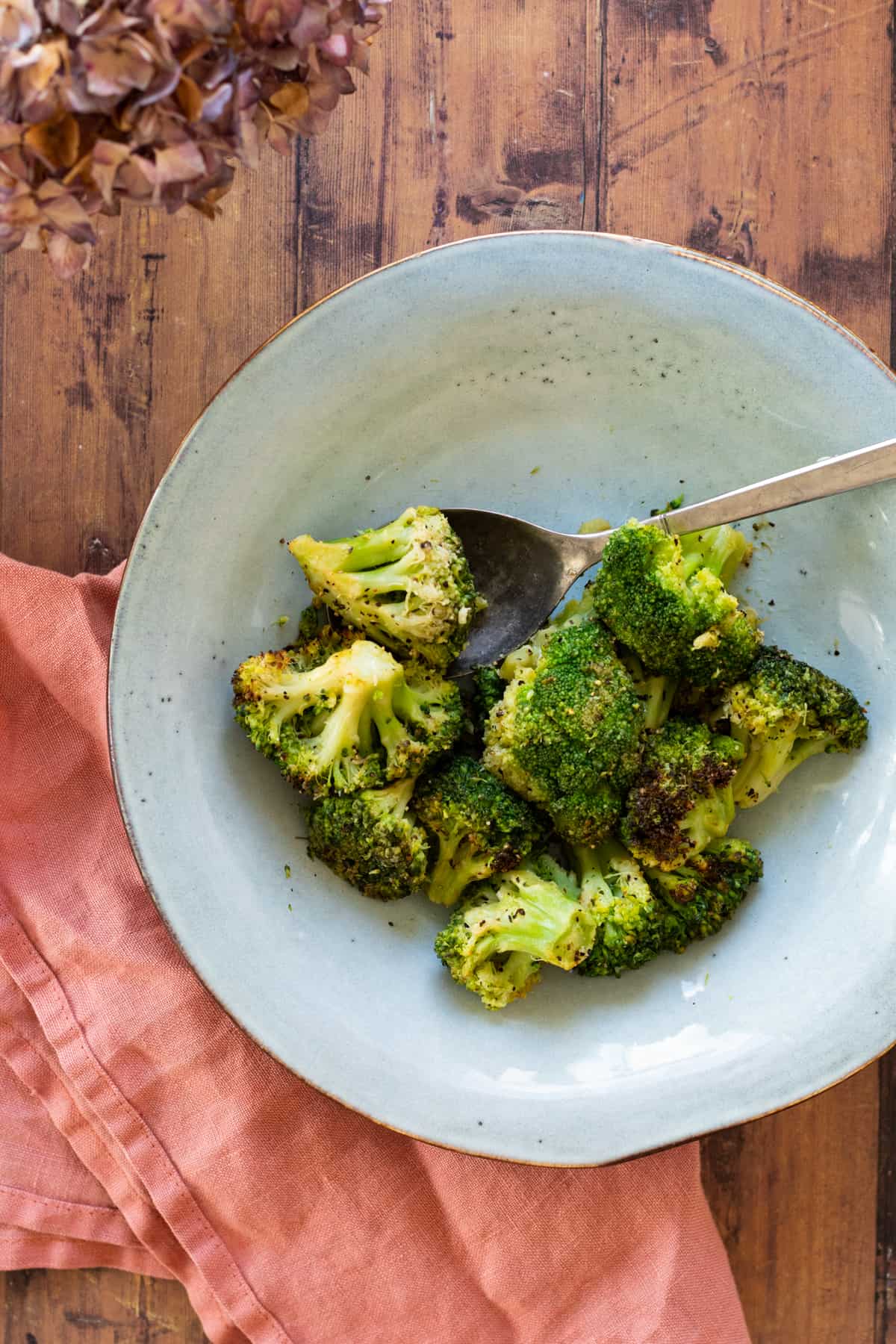 broccoli on a blue plate.