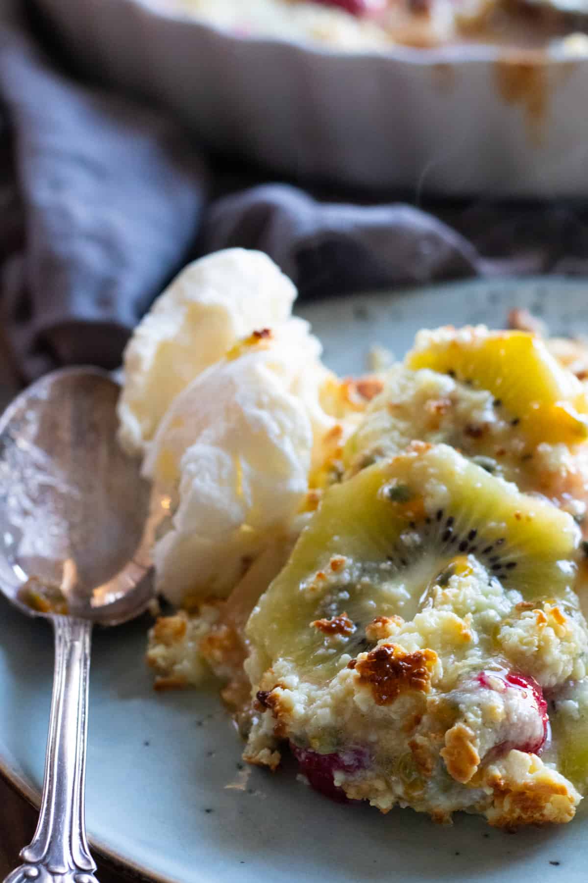 baked fruit with white chocolate on a plate with ice cream