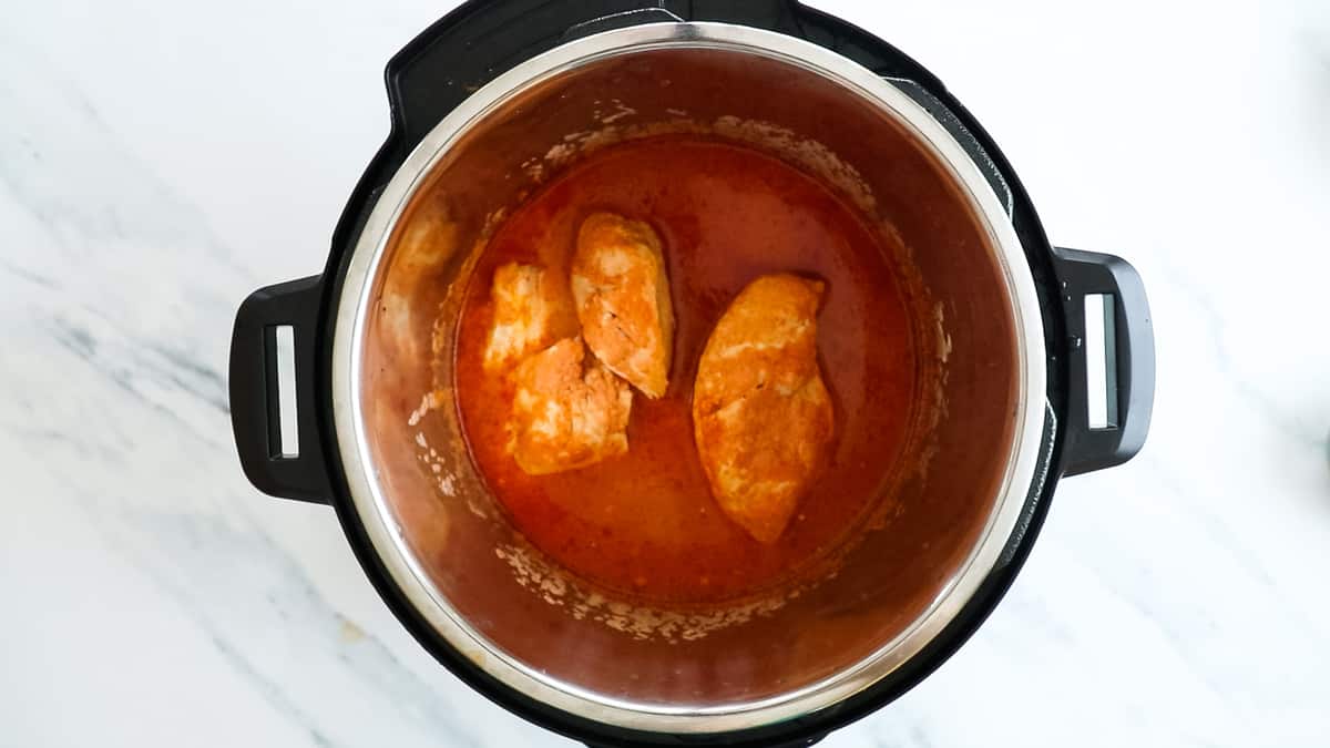 chicken breasts in red sauce after cooking