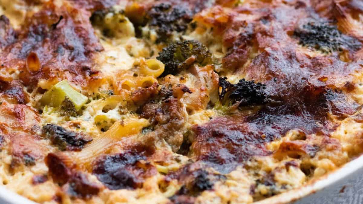 A golden brown chicken broccoli pasta bake after baking.